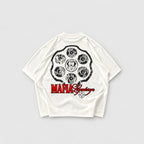 Camiseta boxy color hueso Legendary Mafia con diseño gráfico posterior de símbolos circulares.